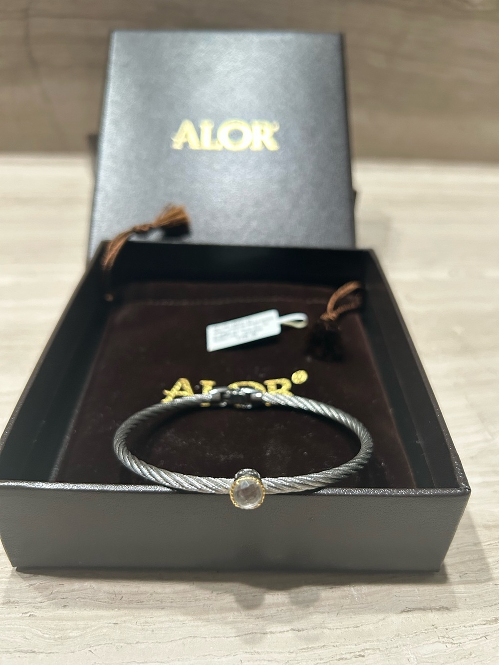 ALOR Silver Cable Twist Stainless Steel Bracelet with White Topaz.